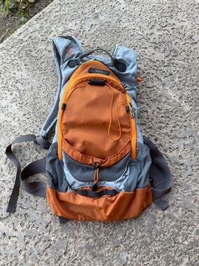 REI Stoke 9 Orange and Gray Hiking Daypack with Front Pocket